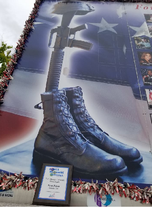 closeup of boots and rifle in Fallen Heroes Banner Project float display