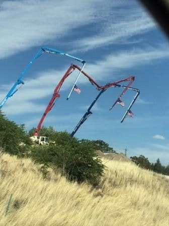 Riverway pump trucks displaying flags over Rock Island