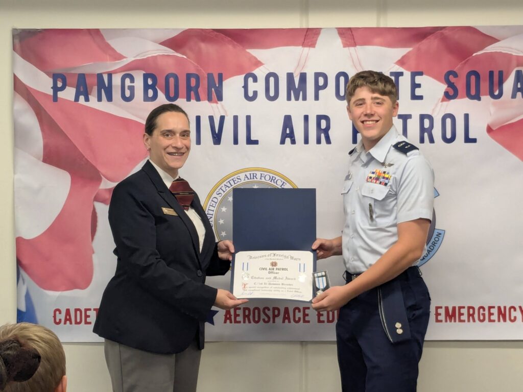 Sarah Simonson presents VFW CAP Cadet Officer Citation to Dawson Brender.
