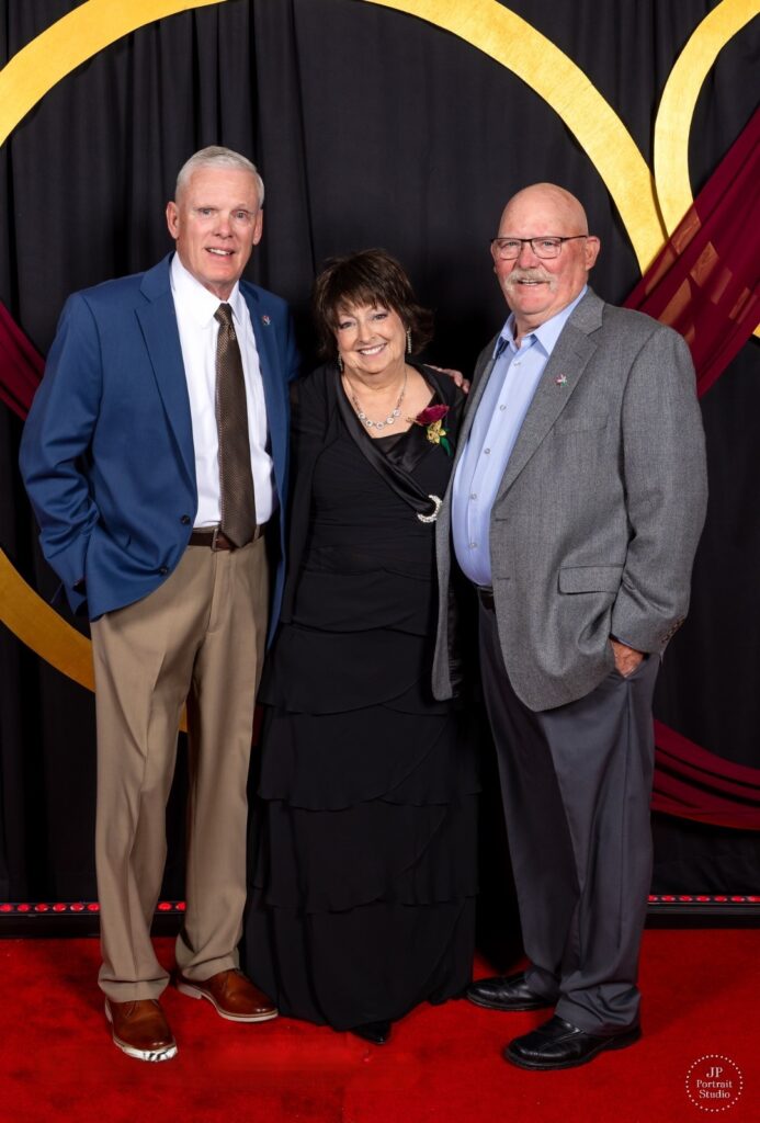 Cancer hero Becky, center, with Brad Pieratt and Steve Johnson