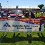 4 children holding up WA Fallen Heroes Banner Project banner