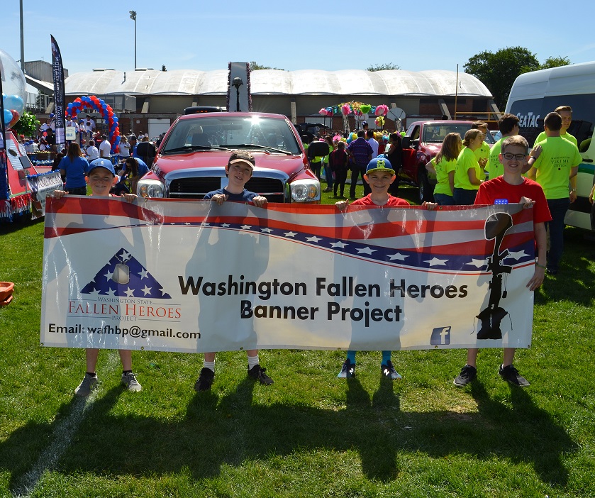 4 children holding up WA Fallen Heroes Banner Project banner