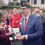 Paul Herrera at US Capital distributing pins with Congresswoman Kim Schreier
