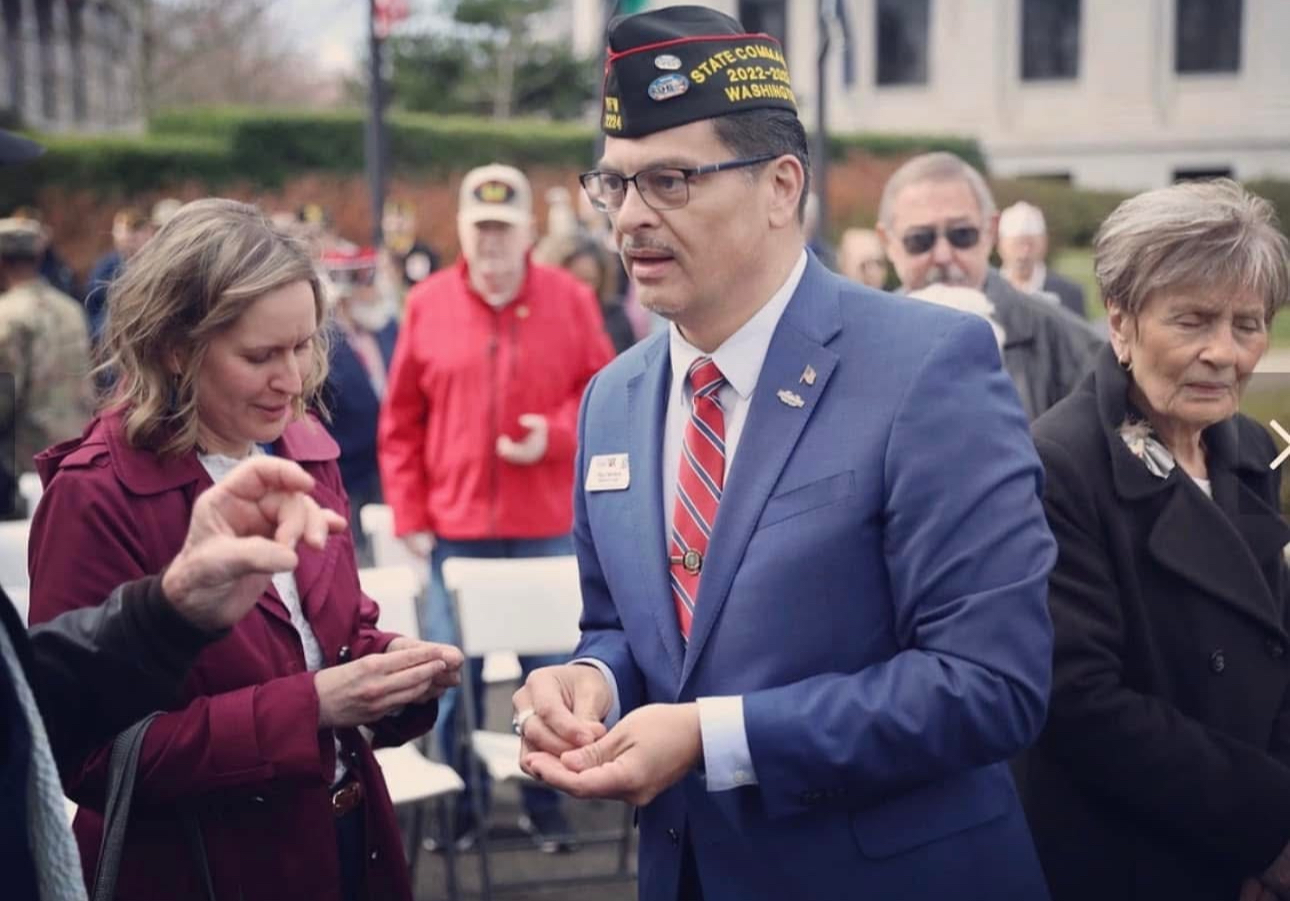 Paul Herrera at US Capital distributing pins with Congresswoman Kim Schreier