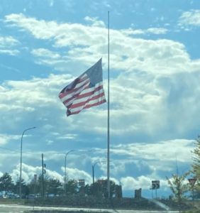 Giant flagpole near Pangborn Airport in East Wenatchee, at half staff marking 1 million COVID deaths