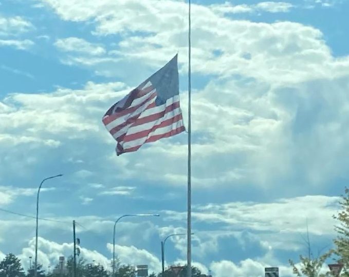 Giant flagpole near Pangborn Airport in East Wenatchee, at half staff marking 1 million COVID deaths