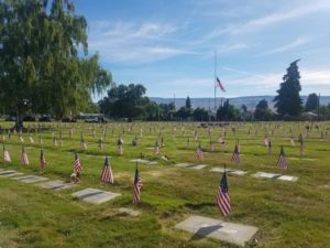 Wenatchee Cemetery showing veteran's graves marked with flags.